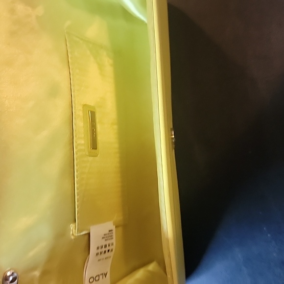 Aldo Yellow Clutch some spots.  Has a snap closure and chain shoulder strap - Picture 7 of 8